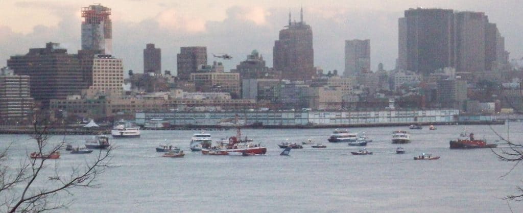 Boats surround the sinking US Airways Flight 1549 on the Hudson River.