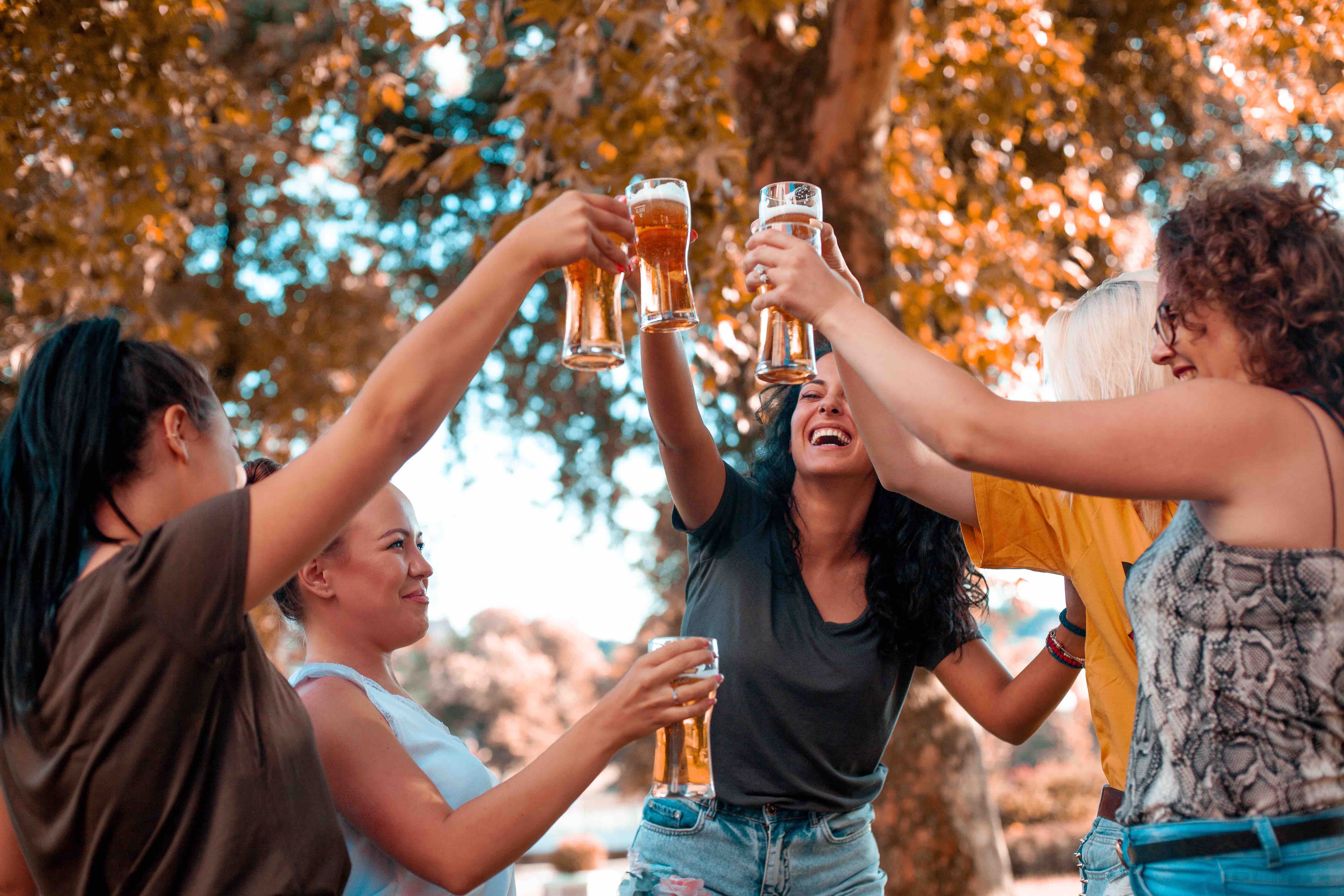 Group of woman celebrating and drinking beer