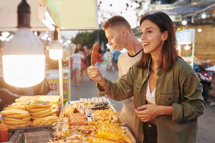 woman buying asian street food