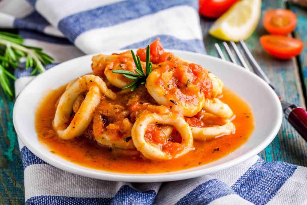 Stewed squid rings in tomato sauce