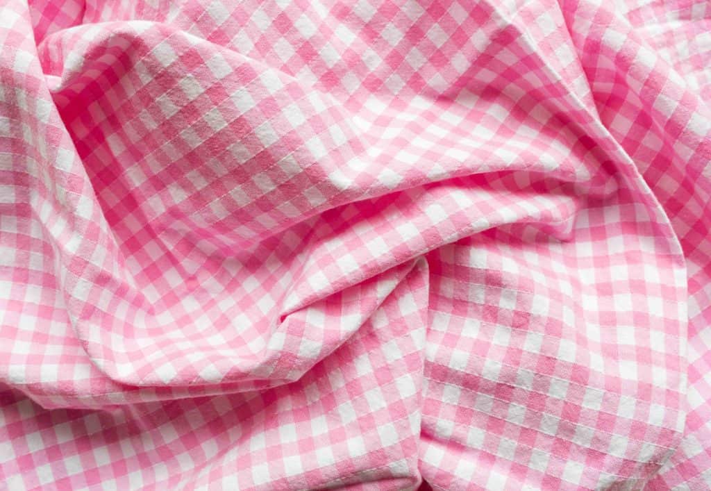 crumpled pink and white gingham fabric
