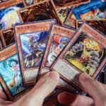 man playing yu-gi-oh cards