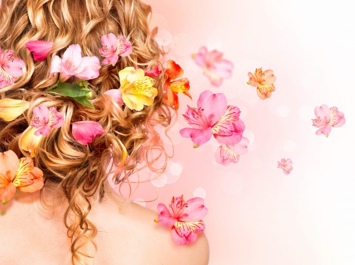 curly hair decorated with flowers