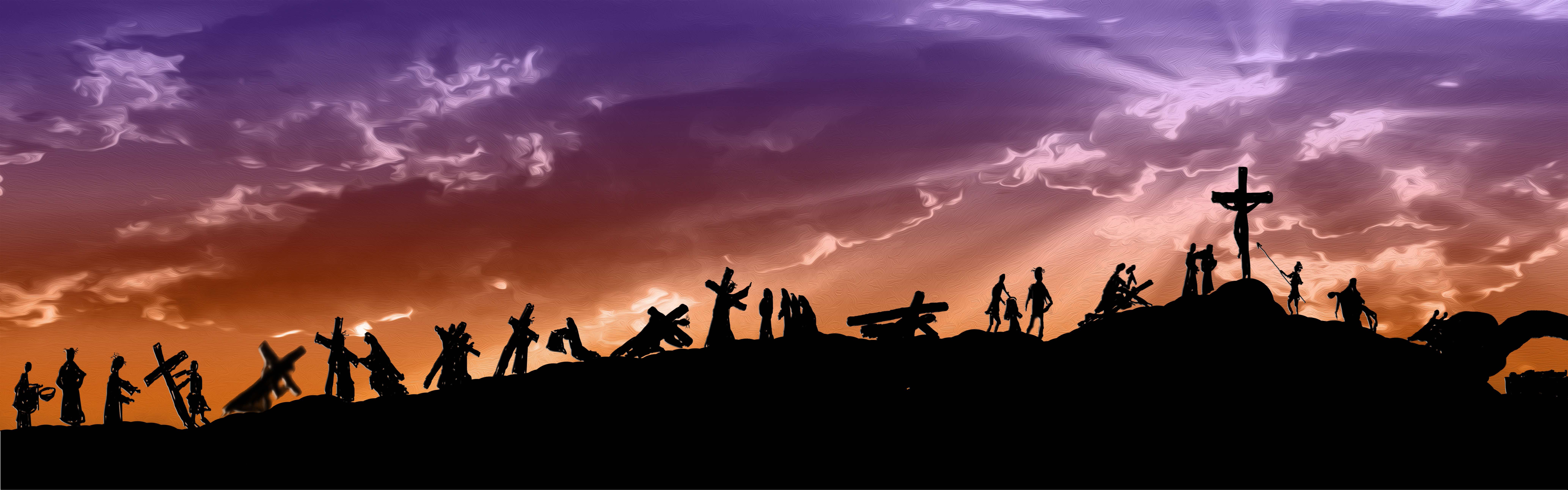 silhouettes of Jesus Christ carrying his cross on Calvary hill