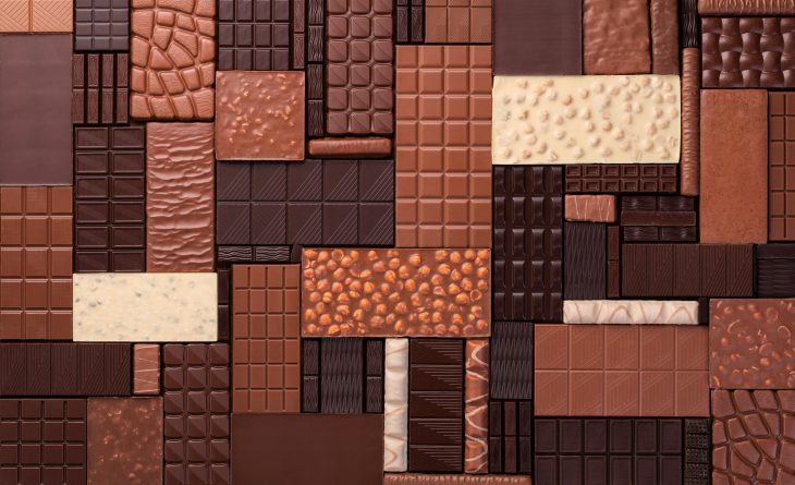 varied chocolate background. milk and dark cocoa bars, top view