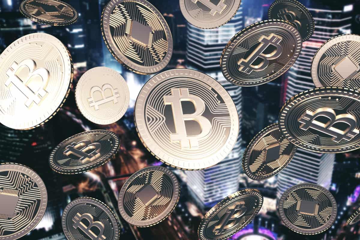 Falling golden bitcoins in night city