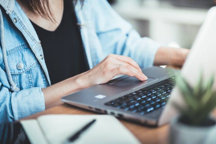 woman working at her office via laptop