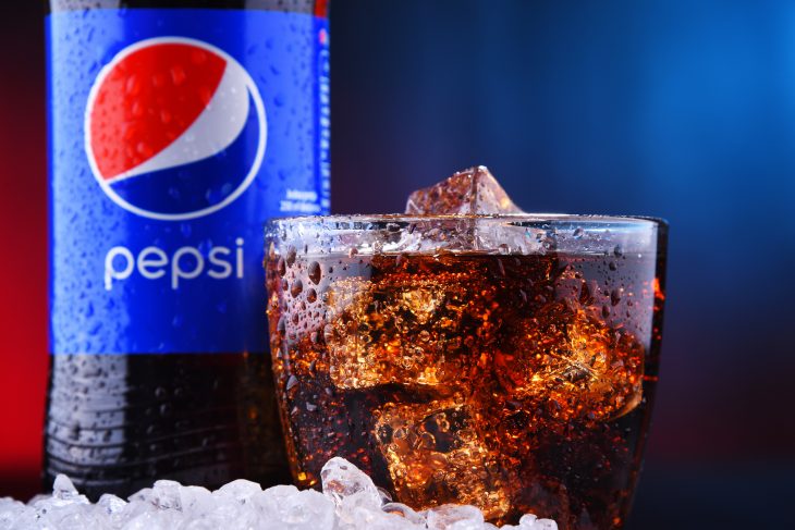 A bottle and a glass of Pepsi