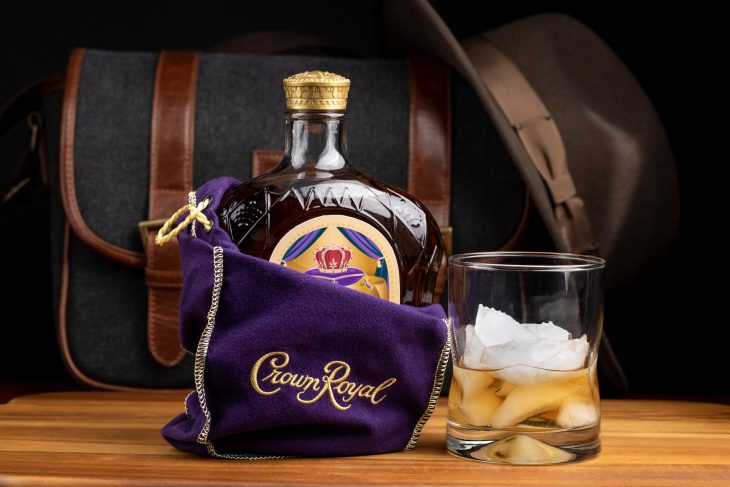 A bottle of Seagram's Crown Royal Canadian rye whiskey in the iconic purple gift bag