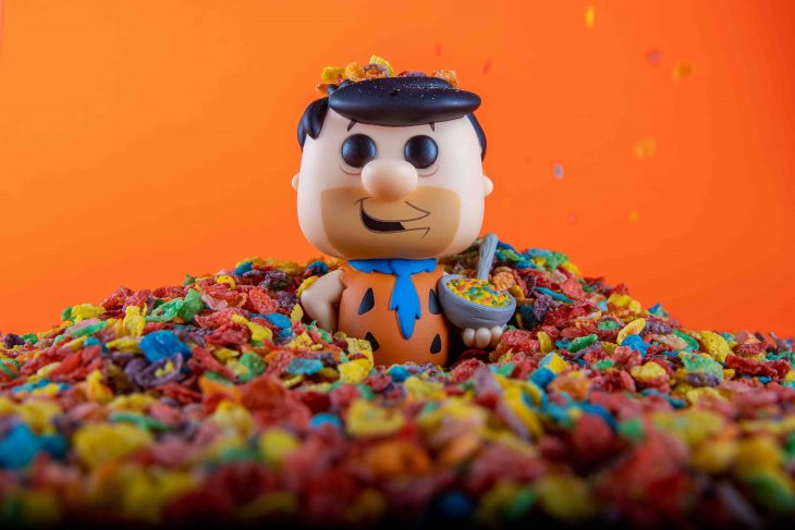 Fred Flintstone Hanna Barbera cartoon Funko Pop! holding a bowl of Fruity Pebbles breakfast cereal