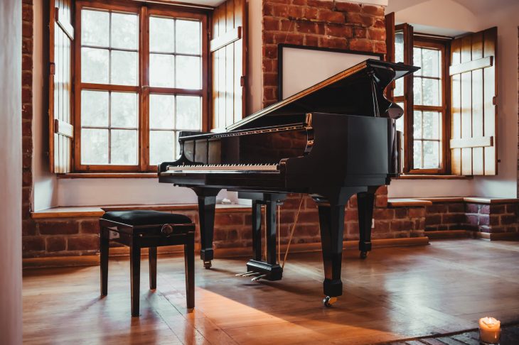 Grand piano in a rustic room