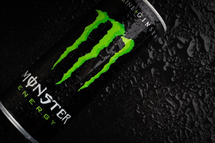 Monster energy drink on black background