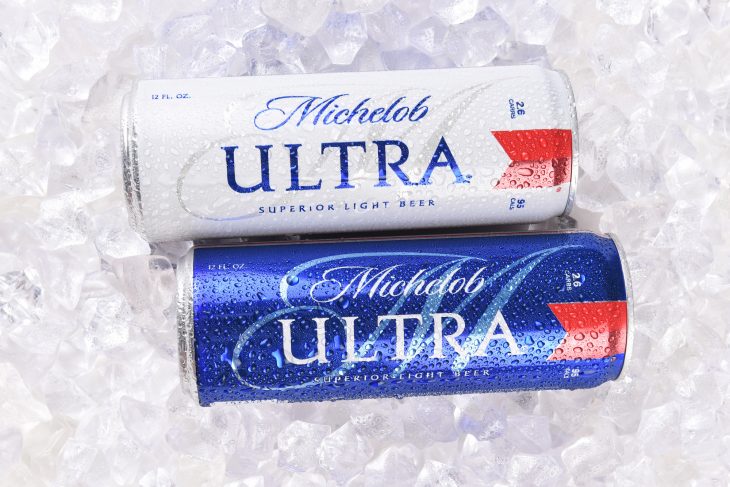 Two Michelob Ultra beer 12 ounce cans in ice