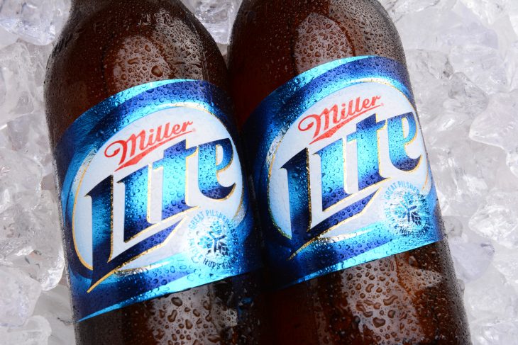 Two bottles of Miller Light on a bed of ice