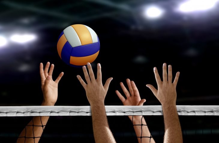 Volleyball spike hand block over the net
