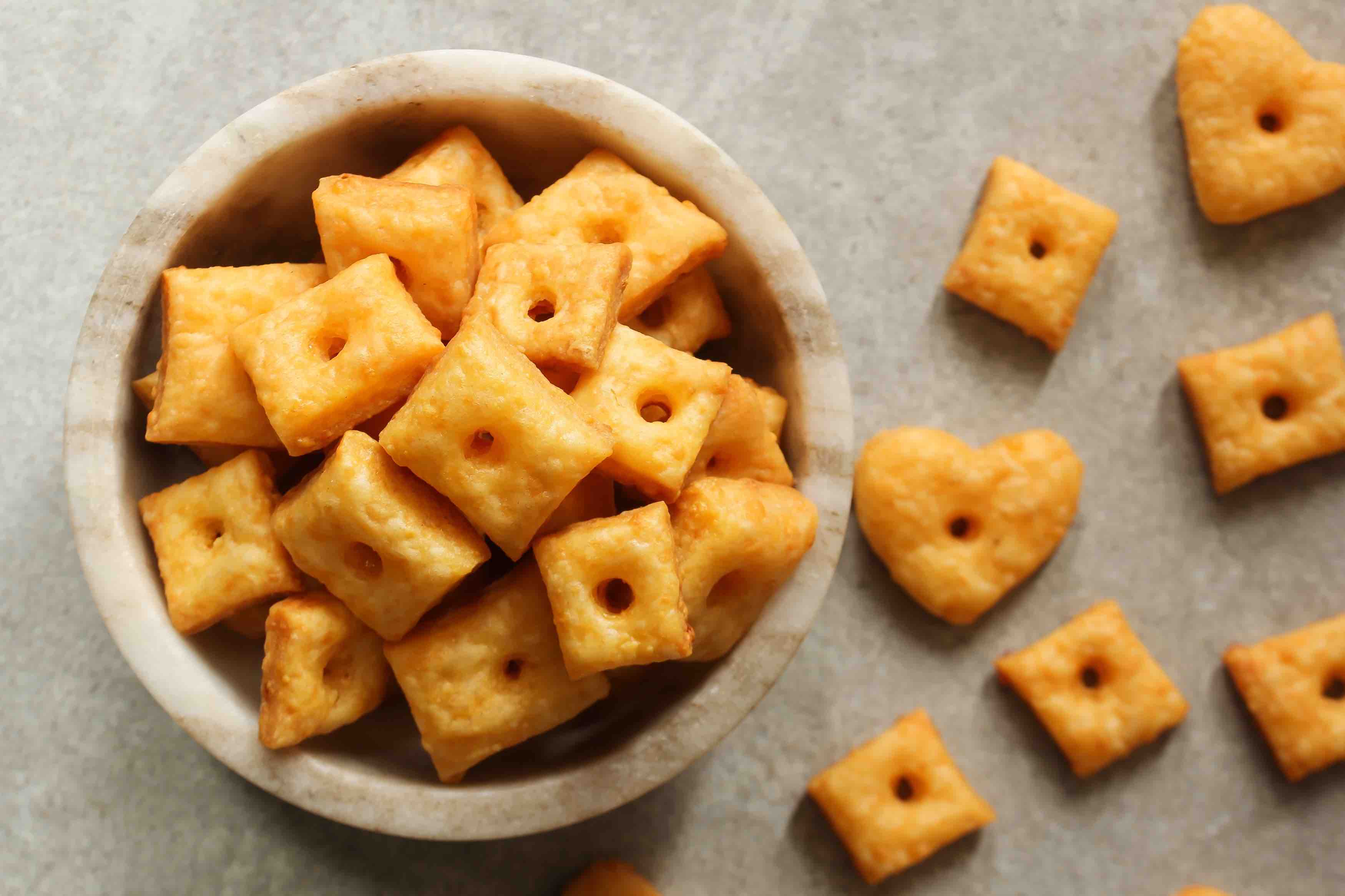 Homemade square Cheese Crackers in a bowl