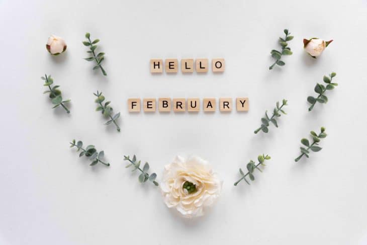 hello February words on white marble background