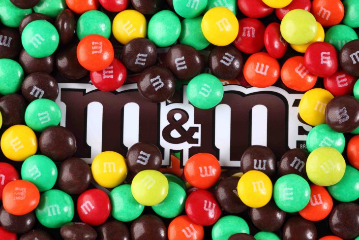 m&m brand logo amongst many m&m chocolates