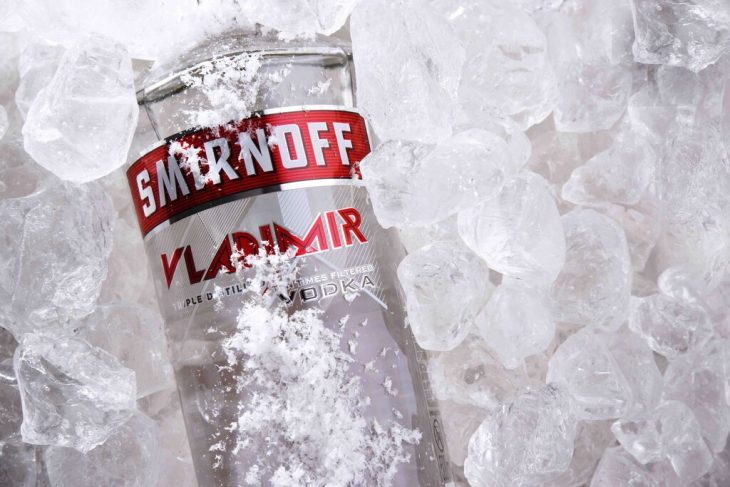 Bottle of Smirnoff, a brand of vodka, covered in ice
