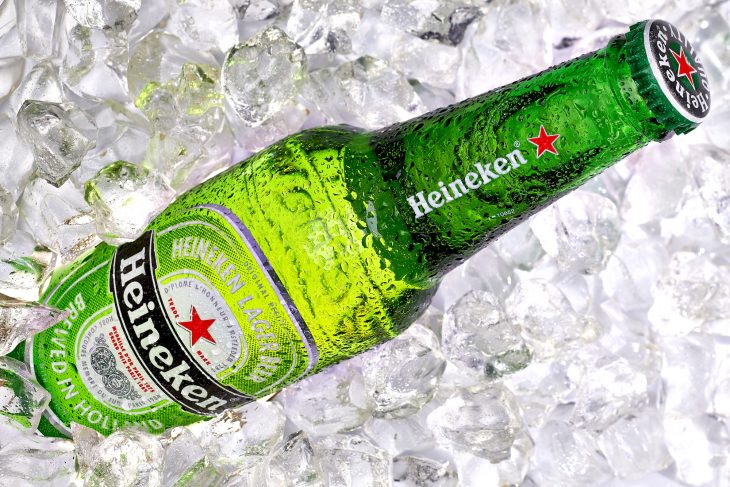 Heineken Beer bottle isolated on ice cubes