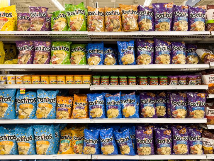 Tostitos products stocked on shelf at supermarket