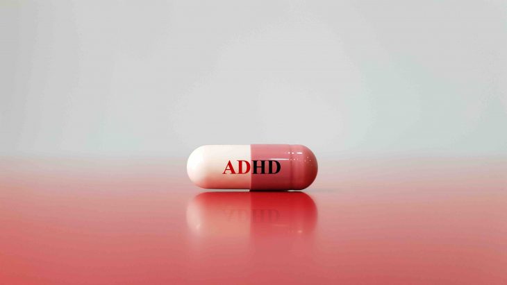 Medication capsule for treatment ADHD(Attention deficit hyperactivity disorder)on red white background. This is mental disorder of neural development cause behavior problem. Medical technology concept