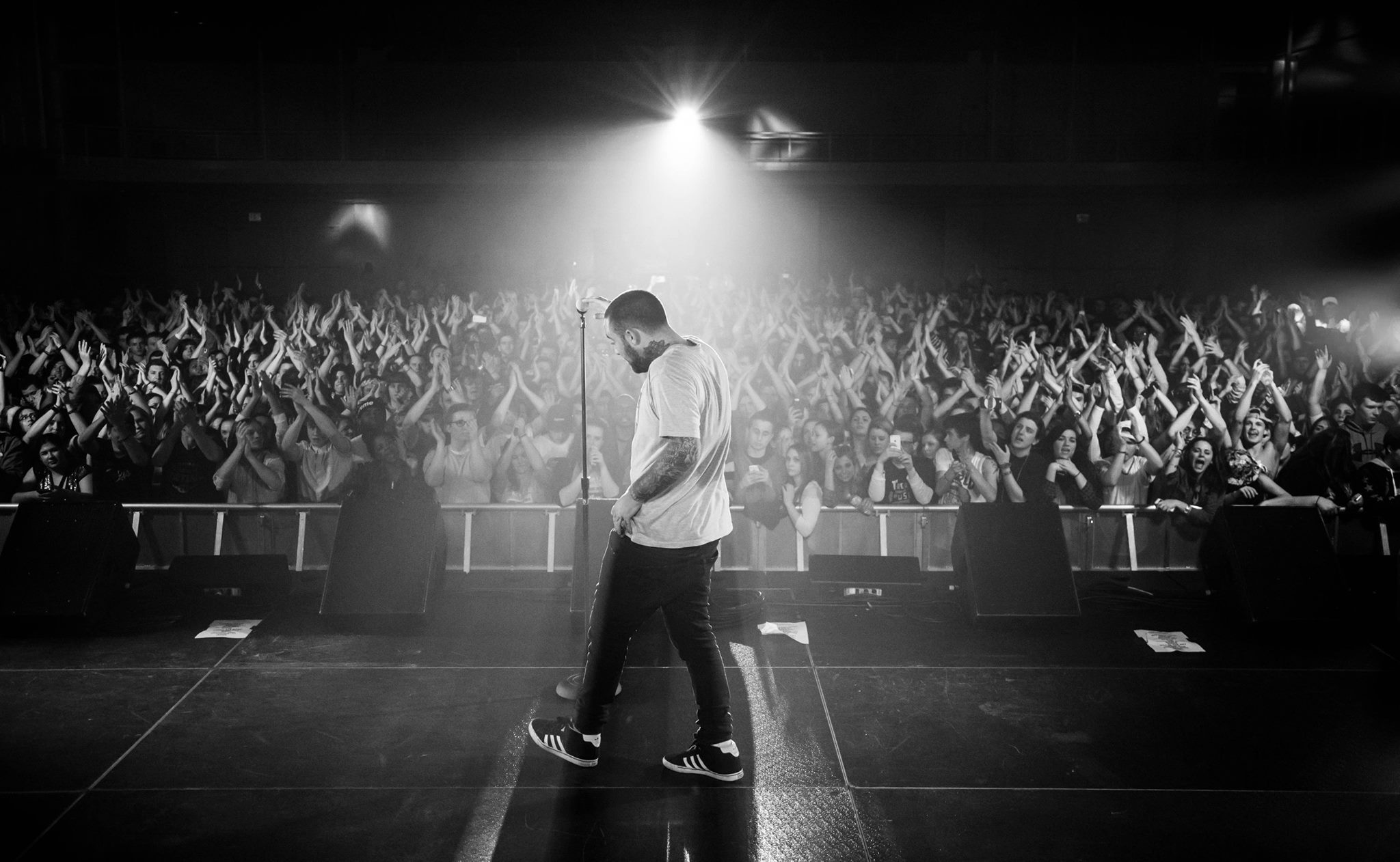 black and white image of mac miller at concert