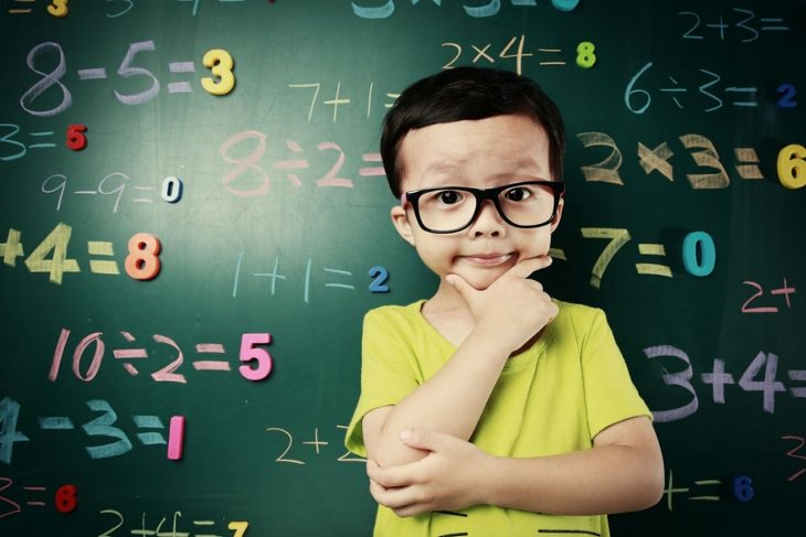 cute asian kid doing math