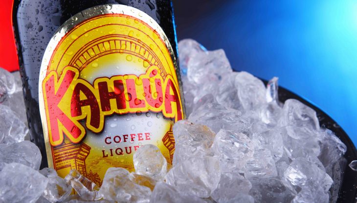 Bottle of Kahlua liqueur in bucket with crushed ice