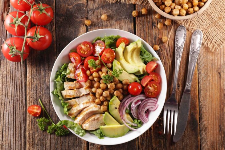 vegetable salad with chicken, chickpea, avocado,tomato and onion