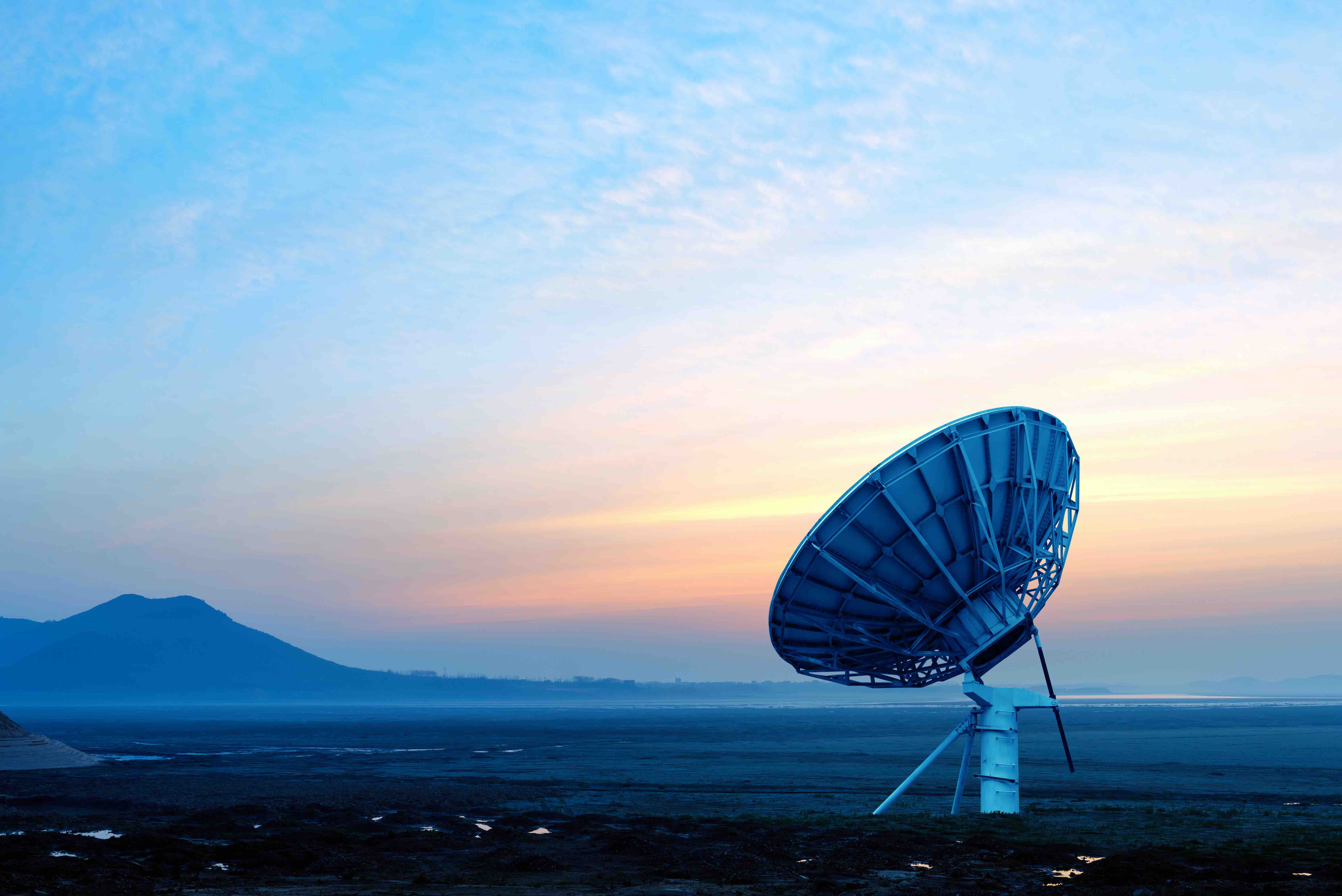Dish on the prairie, early morning sunrise landscape.