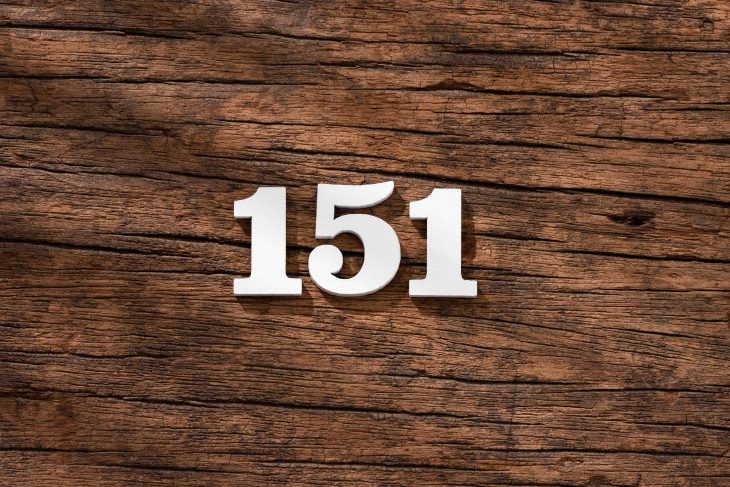 Number 151 - piece on rustic wood background