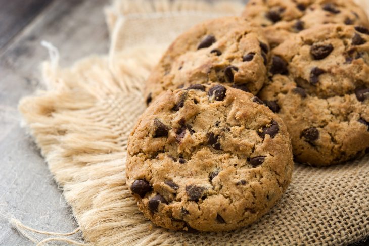 Close up chocolate chip cookies on wooden table background