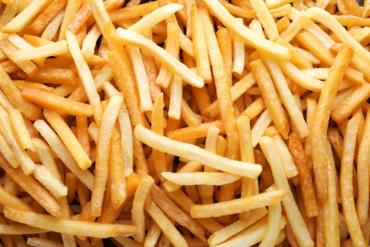 Yummy french fries as background