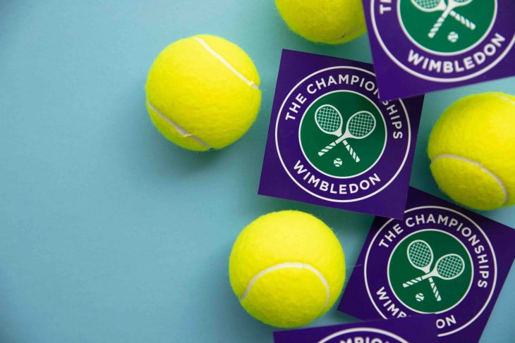 Wimbledon tennis championships logo with tennis ball.