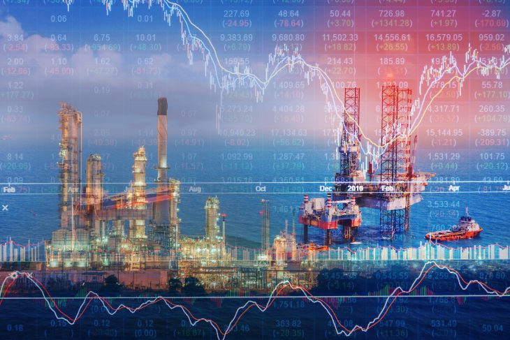 Stock market concept with oil rig in the gulf and oil refinery industry background